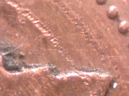 1983-Near-Beads-Cent-With-Concentric-Circles